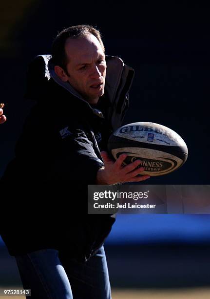 Saracens head coach Brendan Venter catches a ball on the pitch before the game during the Guinness Premiership match between Leeds Carnegie and...