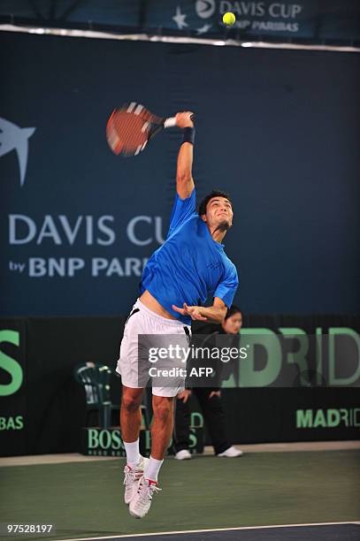 Uzbekistan's Farrukh Dustov serves against China's Wu Di, ranked a lowly 670th in the world, in the final match of the Davis Cup tie in Jiangmen,...