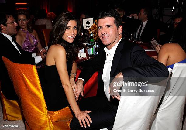 Music producer Simon Cowell and Mezhgan Hussainy attend the 18th Annual Elton John AIDS Foundation Academy Award Party at Pacific Design Center on...