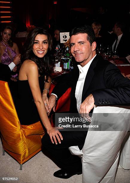 Music producer Simon Cowell and Mezhgan Hussainy attend the 18th Annual Elton John AIDS Foundation Academy Award Party at Pacific Design Center on...