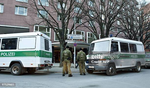 - Picture taken on March 6, 2010 shows police vehicles and police officers standing in front of the Grand Hyatt Hotel at Potsdamer Plarz in Berlin....
