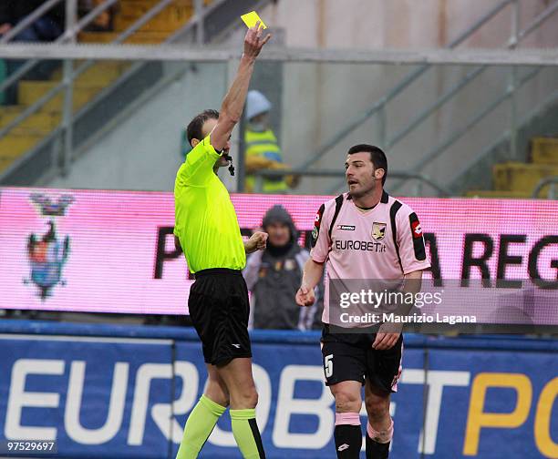 The referee Carmine Russo shows a yellow card to Cesare Bovo of US Citta' di Palermo during the Serie A match between US Citta di Palermo and AS...