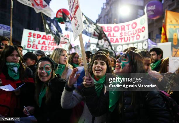 Women chant pro abortion slogans during a rally to demand legal and free abortion at Congressional Plaza on June 13, 2018 in Buenos Aires, Argentina....