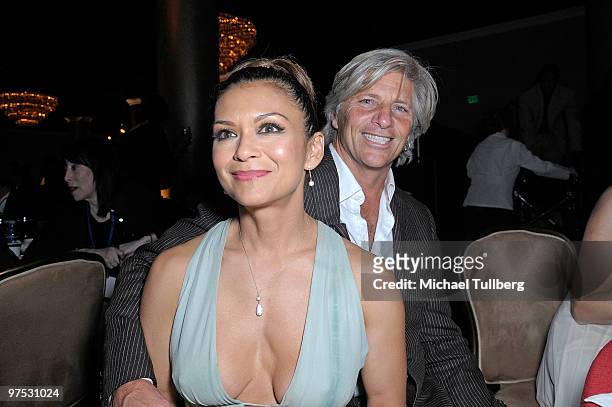 Musician Nia Peeples attends the 11th Annual Children Uniting Nations Oscar Celebration with husband Sam George, held at the Beverly Hilton Hotel on...