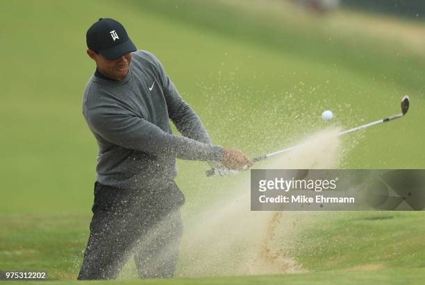Tiger Woods of the United States plays a shot from a bunker on the 15th hole during the second round of the 2018 U.S. Open at Shinnecock Hills Golf...