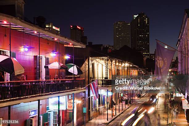 french quarter, bourbon street and city skyline - bourbon street new orleans fotografías e imágenes de stock