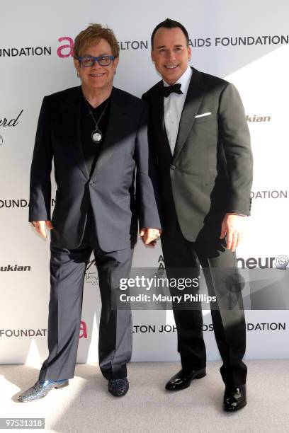Musician Sir Elton John and David Furnish arrive at the 18th annual Elton John AIDS Foundation Oscar Party held at Pacific Design Center on March 7,...