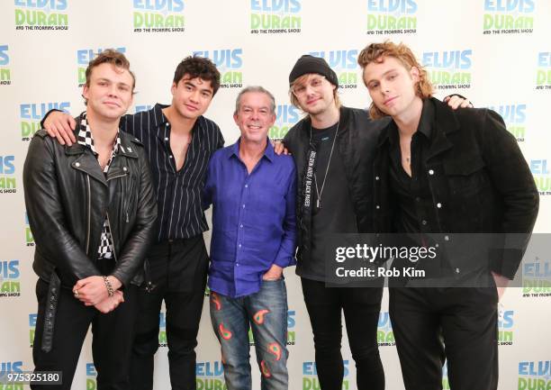 Ashton Irwin, Calum Hood, Michael Clifford and Luke Hemmings of 5 Seconds Of Summer pose with host Elvis Duran at "The Elvis Duran Z100 Morning Show"...