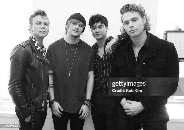 Ashton Irwin, Michael Clifford, Calum Hood and Luke Hemmings of 5 Seconds Of Summer visit "The Elvis Duran Z100 Morning Show" at Z100 Studio on June...