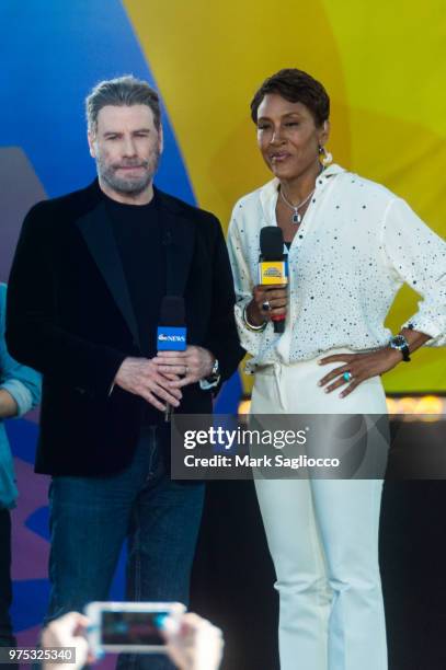 Actor John Tavolta and Good Morning America's Co-Host Robin Roberts attend Pitbull's performance on ABC's "Good Morning America" at Rumsey Playfield,...