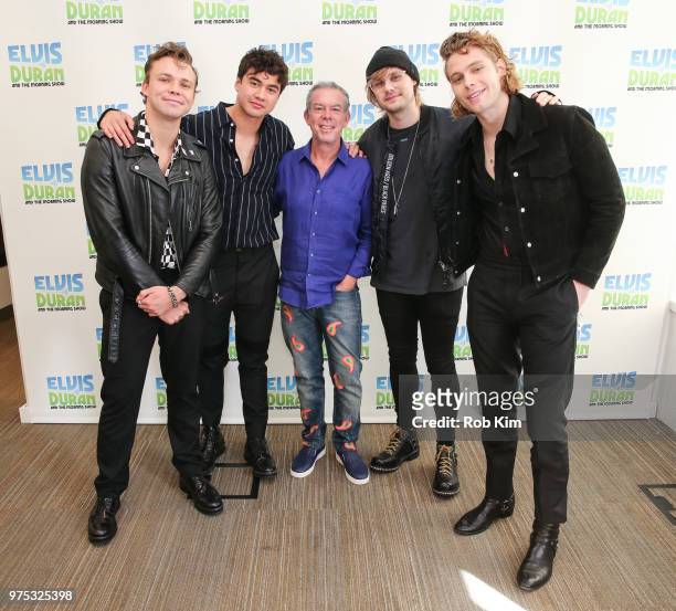 Ashton Irwin, Calum Hood, Michael Clifford and Luke Hemmings of 5 Seconds Of Summer pose with host Elvis Duran at "The Elvis Duran Z100 Morning Show"...