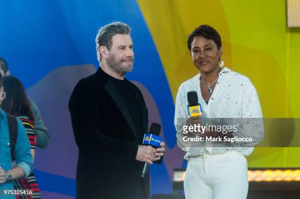 Actor John Tavolta and Good Morning America's Co-Host Robin Roberts attend Pitbull's performance on ABC's "Good Morning America" at Rumsey Playfield,...