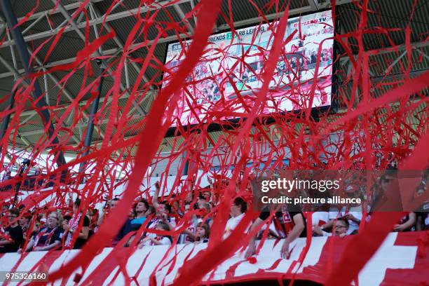 May 2018, Germany, Leipzig: Soccer: Bundesliga: RB Leipzig at the Red Bull Arena: Fans throw red paper bands. A farewell match takes place for the...