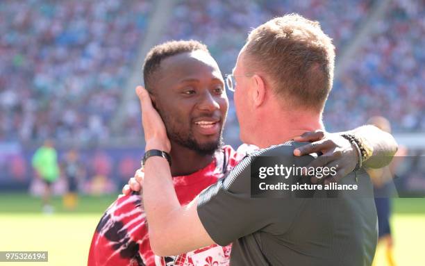 May 2018, Germany, Leipzig: Soccer: Bundesliga: RB Leipzig at the Red Bull Arena: RB's sporting director Ralf Rangnick hugs Naby Keita, who will...