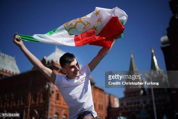 Football fans from Tajikistan join in the party atmosphere of The World Cup near Red Square on June 15, 2018 in Moscow, Russia. Russia won the...