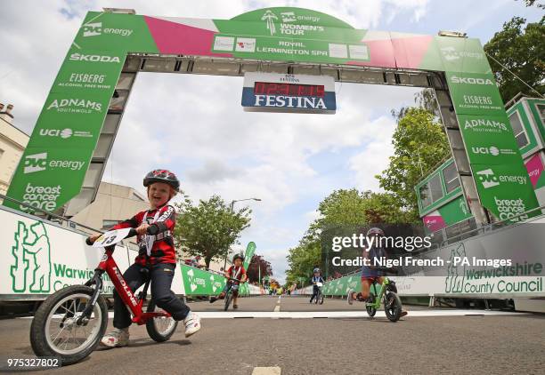 Children between the ages of two and five years old competing in the Strider Race Series cross the finishing line at Royal Leamington Spa during...