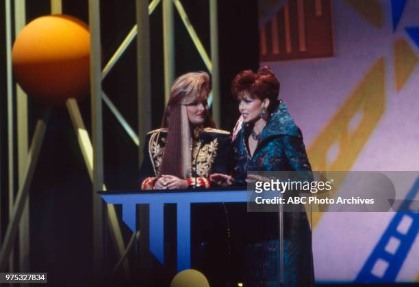Los Angeles, CA Wynonna Judd, Naomi Judd, The Judds presenting on the 17th Annual American Music Awards, Shrine Auditorium, January 22, 1990.