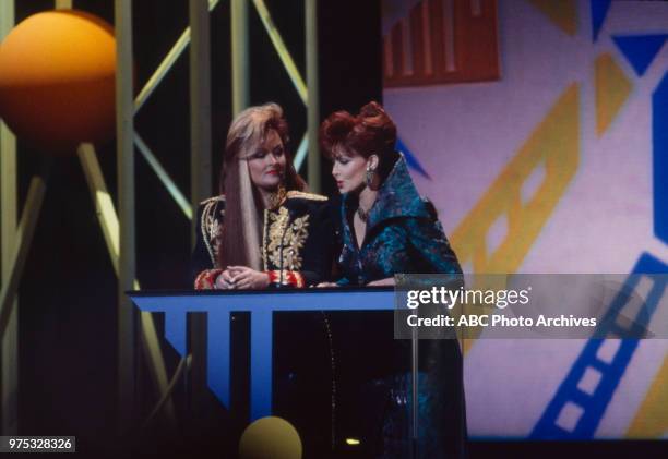 Los Angeles, CA Wynonna Judd, Naomi Judd, The Judds presenting on the 17th Annual American Music Awards, Shrine Auditorium, January 22, 1990.