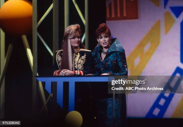 Los Angeles, CA Wynonna Judd, Naomi Judd, The Judds presenting on the 17th Annual American Music Awards, Shrine Auditorium, January 22, 1990.