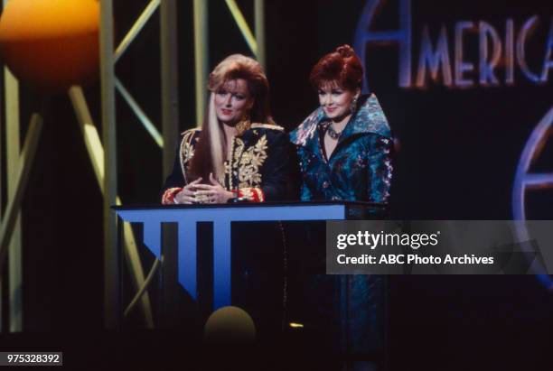 Los Angeles, CA Wynonna Judd, Naomi Judd, The Judds presenting on the 17th Annual American Music Awards, Shrine Auditorium, January 22, 1990.