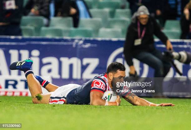 Zane Tetevano of the Roosters scores a try during the round 15 NRL match between the Sydney Roosters and the Penrith Panthers at Allianz Stadium on...