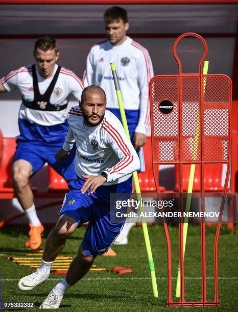 Russia's defender Andrei Semyonov, Russia's defender Fyodor Kudryashov and Russia's defender Vladimir Granat attend a training session in Novogorsk...