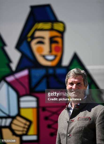 May 2018, Germany, Rothaus: Christian Rasch, CEO of Baden's state brewery Rothaus, stands in front of a truck with the image of 'Birgit', the...