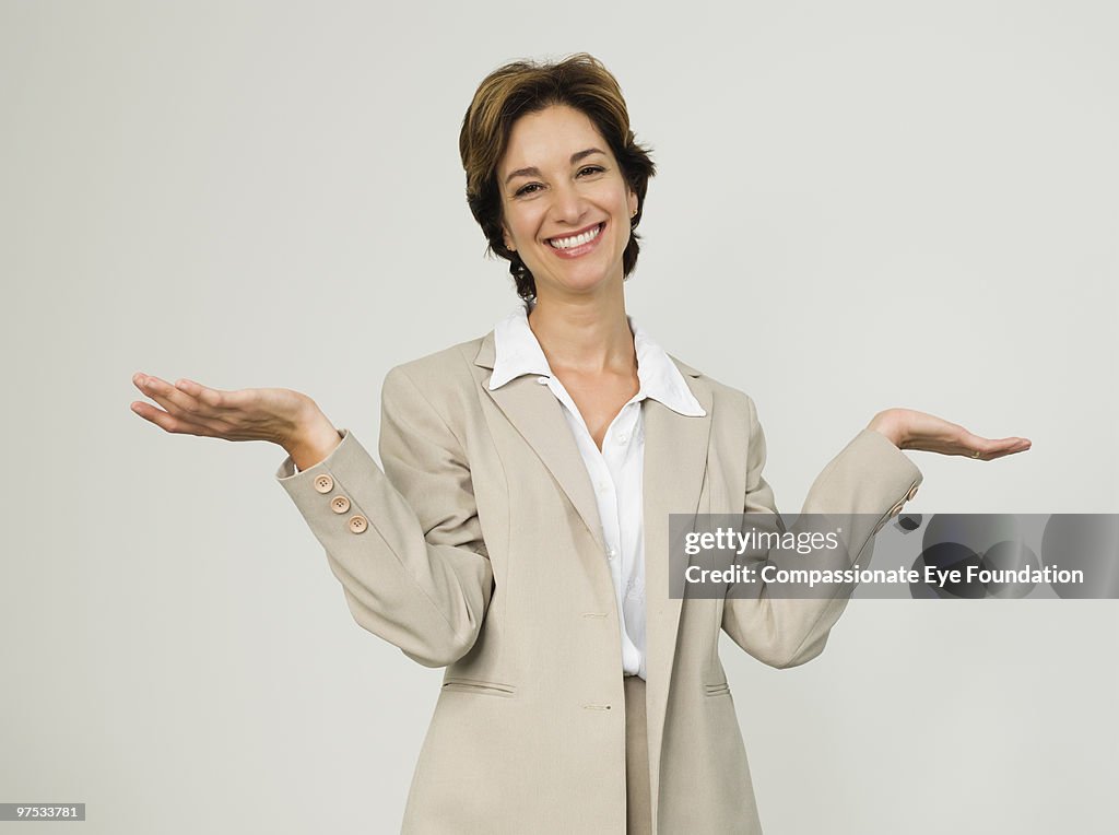 Portrait of business woman with her arms raised