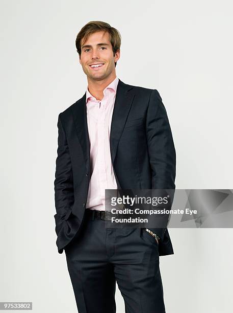 portrait of smiling business man - three quarter length stock pictures, royalty-free photos & images