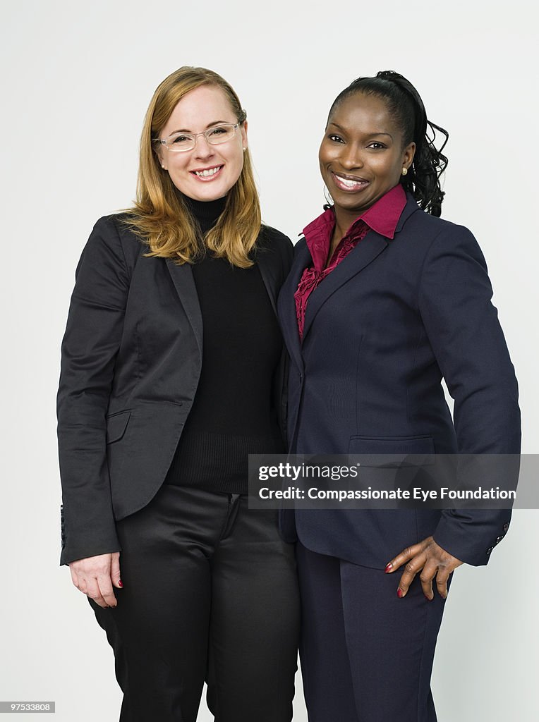 Two smiling business women