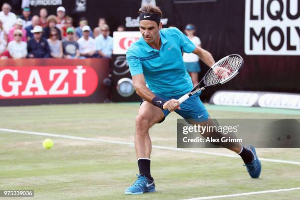 Roger Federer of Switzerland plays a backhand to Guido Pella of Argentina during day 5 of the Mercedes Cup at Tennisclub Weissenhof on June 15, 2018...