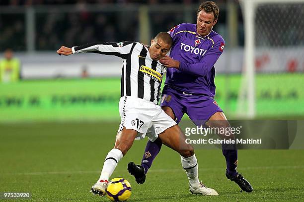 Cesare Natali of ACF Fiorentina battles for the ball withDavid Trezeguet of Juventus FC during the Serie A match between at ACF Fiorentina and...
