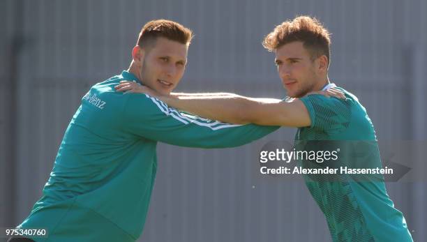 Niklas Suele warms up with team mate Leon Goretzka during the Germany Training And Press Conference at Sport Base Vatutinki on June 15, 2018 in...