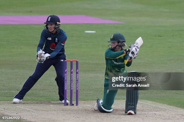 Dane van Niekerk of South Africa Women hits a boundary as Sarah Taylor of England Women looks on during the 3rd ODI of the ICC Women's Championship...