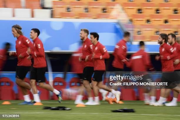 Denmark's players take part in a training session of Denmark's national football team at the Mordovia Arena in Saransk, on June 15, 2018 on the eve...
