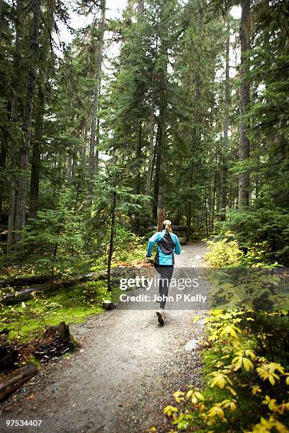 woman running - john p kelly stock pictures, royalty-free photos & images