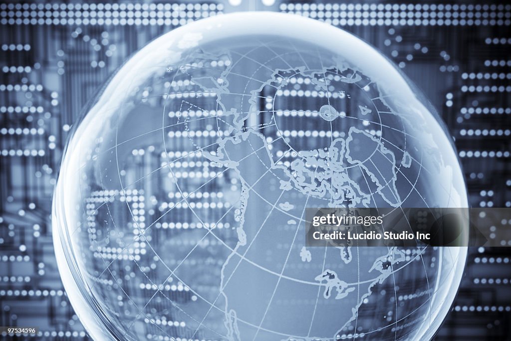 Globe against a printed circuit board background