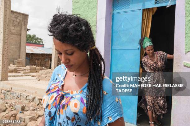 Melaete Gueshe , originally from Axum, works as a waiteress at a bar in Badme, a disputed town on the border between Ethiopia and Eritrea on June 14,...