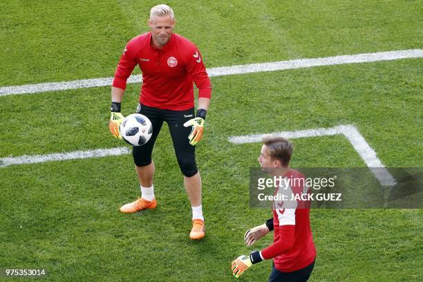 Denmark's goalkeeper Kasper Schmeichel and Denmark's goalkeeper Frederik Ronnow take part in a training session of Denmark's national football team...