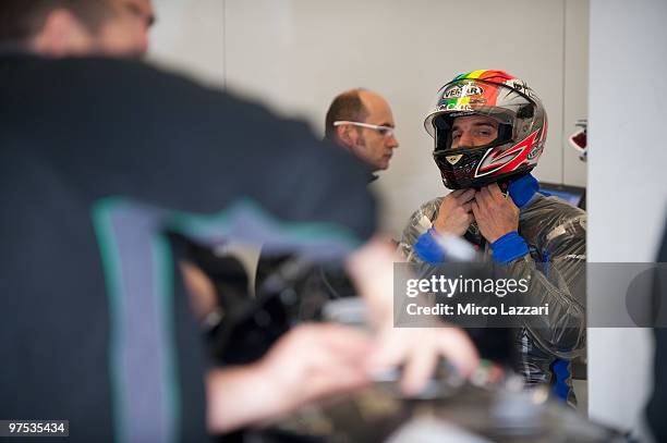 Alex De Angelis of San Marino and Scot Racing Team prepares in box during the first day of testing at Circuito de Jerez on March 6, 2010 in Jerez de...