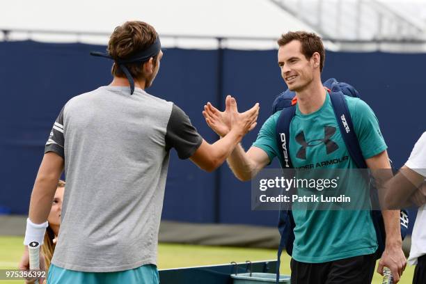 Andy Murray of Great Britain shake hands with Cameron Norrie of Great Britain ahead of their practice session during preview Day 3 of the Fever-Tree...