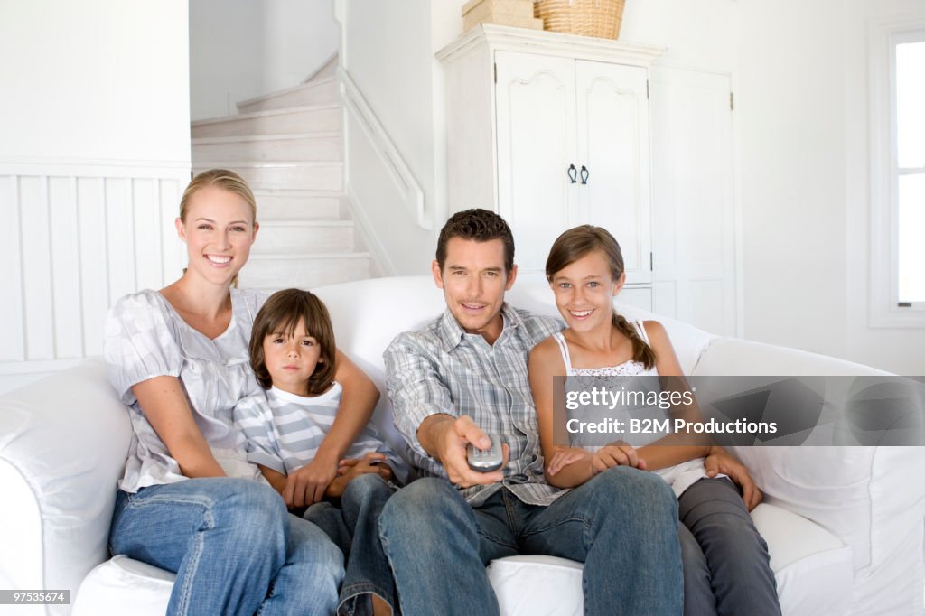 Family watching television together