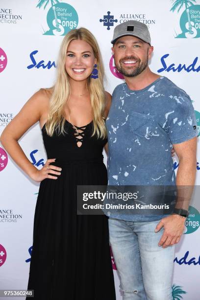 Hosts Marley Sheerwood and Cody Alan make a red carpet appearance at Sandals Royal Bahamian during CMT Story Behind the Songs LIV+ Weekend on June...