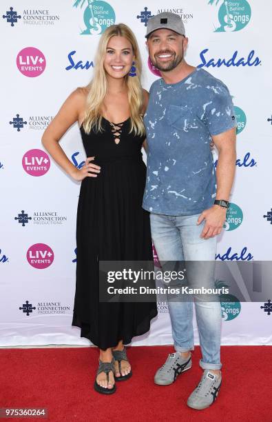 Hosts Marley Sheerwood and Cody Alan make a red carpet appearance at Sandals Royal Bahamian during CMT Story Behind the Songs LIV+ Weekend on June...