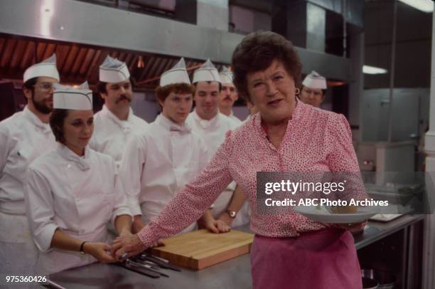 Julia Child cooking with chefs.