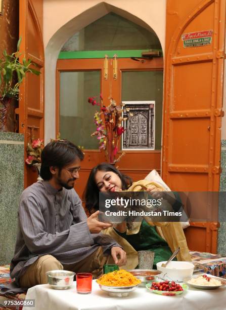 Teacher and an Urdu Aficionado Sadia Syed with her friend, founder of the Portal Purani Dilli Walo ki Baatein Abu Sufiyan poses for a special shoot...