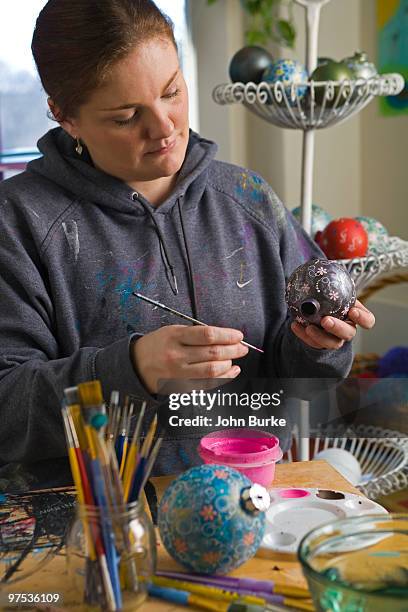 woman painting ornaments - natick stock pictures, royalty-free photos & images