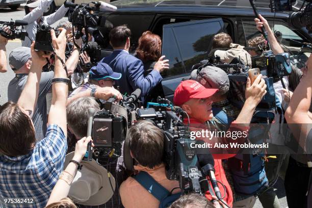 Kathleen Manafort, wife to former Trump campaign manager Paul Manafort is helped to a waiting car after her husband's bail was revoked during a...