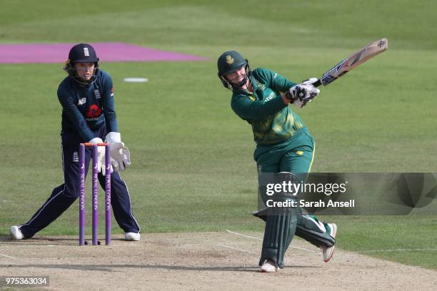 Dane van Niekerk of South Africa Women hits a boundary as Sarah Taylor of England Women looks on during the 3rd ODI of the ICC Women's Championship...