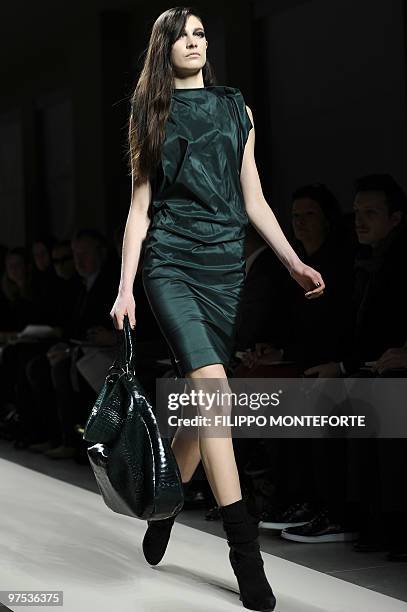 Model displays a creation as part of Bottega Veneta Fall-Winter 2010-2011 ready-to-wear collection on February 27, 2010 during the Women's fashion...